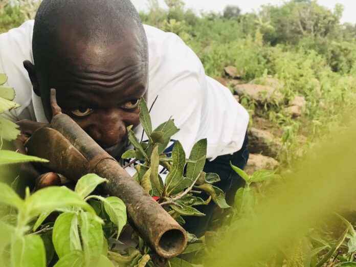Vigilante taking aim with pipe gun shotgun. in a file photograph Photo by Masara Kim for TruthNigeria.com
