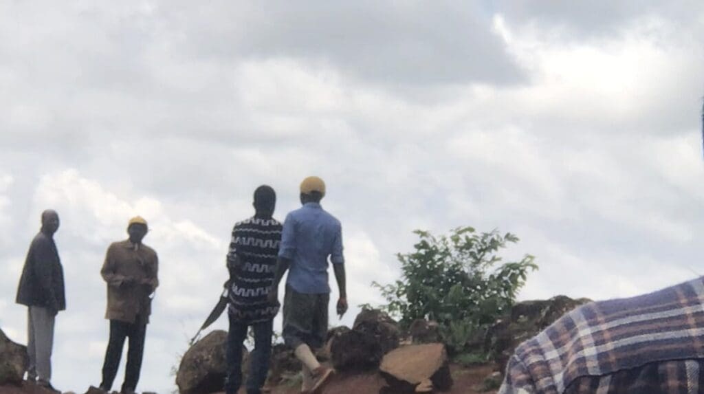 Vigilantes patrol bushes in a terrorized region of Plateau State on 9 July. Photo by Masara Kim.