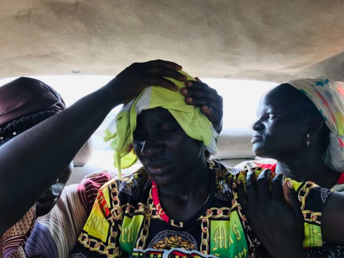 Protestor with head bandage is conveyed by van to a local hospital Monday morning, Aug. 7. Photo by Masara Kim.