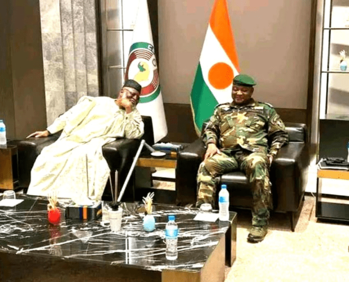 Nigeria’s ECOWAS Envoy Rtd Gen. Abdulsalami Abubakar shares a joke with Niger junta leader Brig.-Gen Abdourahamane Tchiani during talks in Niamey during an August 19 meeting. Image via Government of Niger.