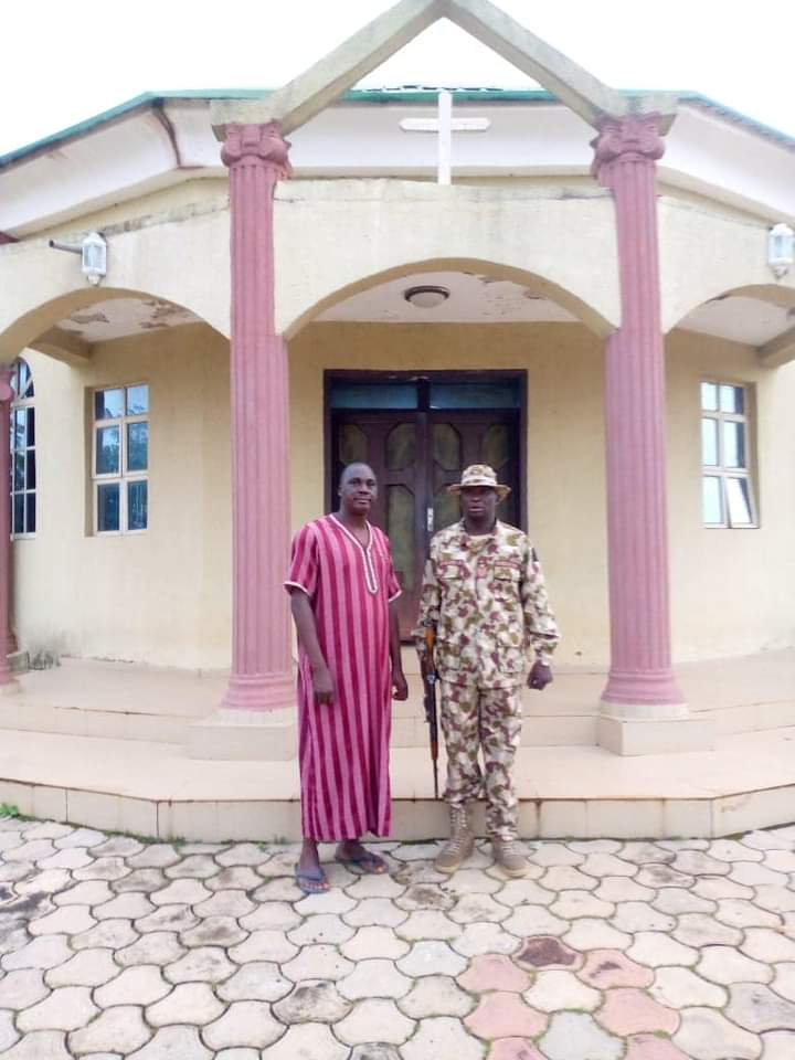 Bishop Paul Zamani, left, in Sambak Gida Village, Jaba County. Photo by Nigerian Army.