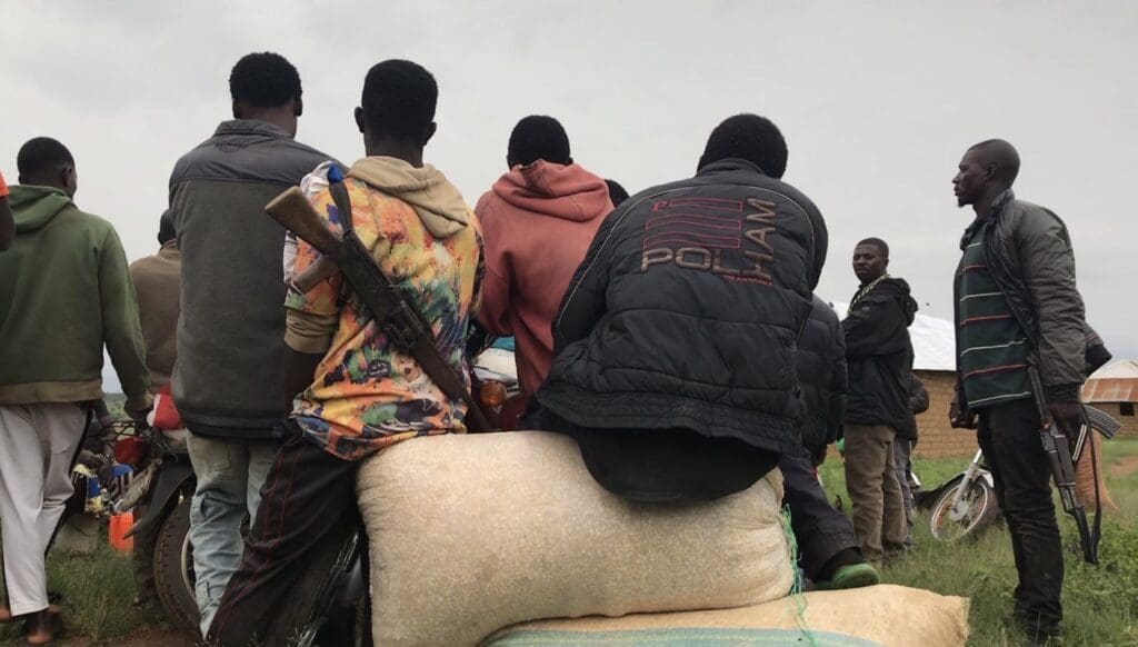 A band of citizen guards awaits news of a security threat June 18 in Plateau State, which neighbors Kaduna State. credit Masara Kim.