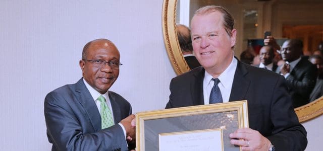 The Governor, Central Bank of Nigeria (CBN), Mr. Godwin Emefiele, left, lauded in 2017 with the Forbes Best of Africa Innovative Banking Award by the Forbes Magazine./ credit : Central Bank of Nigeria.