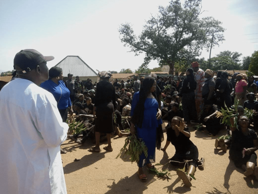 Protesting women in Panyam sit in highway singing gospel songs on 28 September. Credit Abner Chorbe