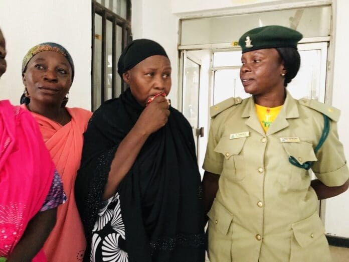 It's 10:30 AM on October 16 in Bauchi, the capital of Bauchi State in northeastern Nigeria. Rhoda Adamu Jatau, a Christian mother of five, is escorted by prison guards to the State High Court, where she is on trial for allegedly insulting Prophet Mohammed. credit: Masara Kim.