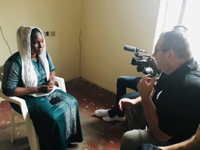 Judd interviewing a widowed survivor of terrorists attacks near Jos