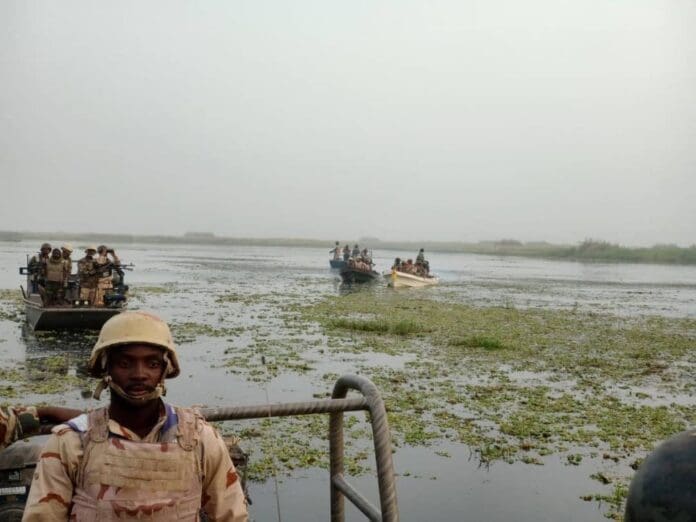 Stuck in the mud:  Multinational force of Nigerian, Cameroonian and Nigerien soldiers patrolling Lake Chad in 2022. Courtesy of Multinational force public affairs.  Analysts say Nigerian “manages” the insurgency but never lands a knockout punch.