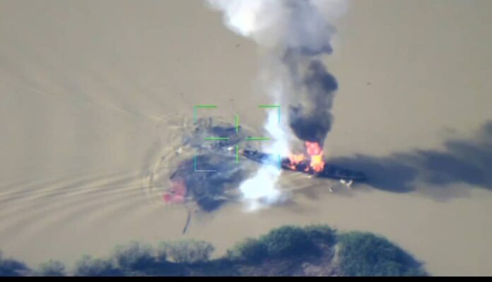 Yellow Jambros' boat on flames after military strike Credit: X/ZagazolaMakama.