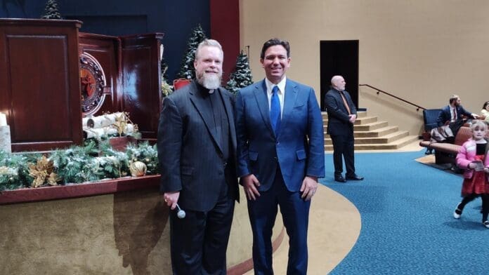 GOP Presidential candidate Ron DeSantis (right) stops at Cornerstone Church in Sioux City Iowa and speaks with Pastor Cary Gordon (left). Photo by Truth Nigeria.