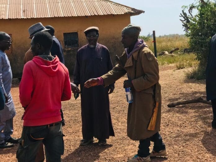 Civilian watchers guarding abandoned houses in Bokkos County, 40 miles south of Jos, after devastating attacks by Fulani terrorists. Credit: Masara Kim.