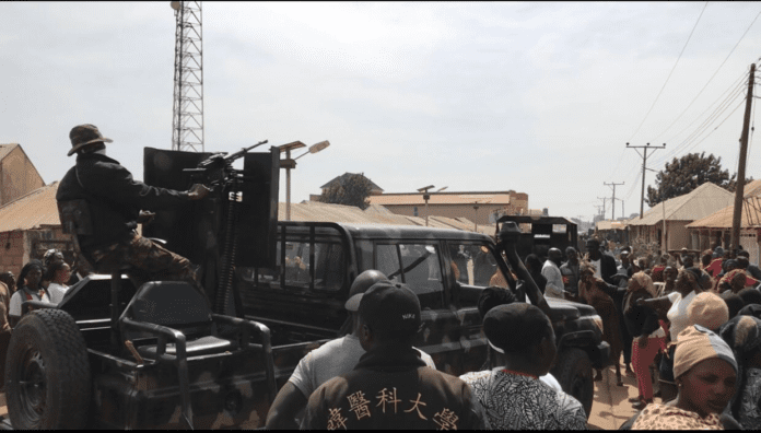 Outraged citizens in Bokkos, a town in terrorist-ravaged Bokkos County on Jan. 5, cursing Nigerian army for failing to defend them from attacks by hundreds of Islamist militia.  photo by Masara Kim