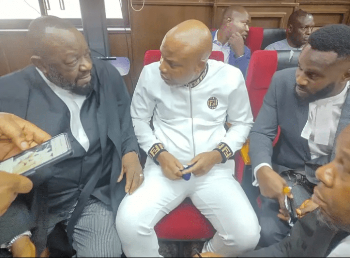 Nnamdi Kanu (middle) with his lawyers in court on Monday. Photo credit: Facebook/Vanguard News.