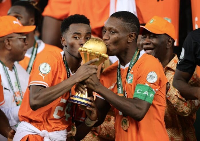 Team Cote D'Ivoire with the AFCON trophy. Photo credit: X/@CAFOnline