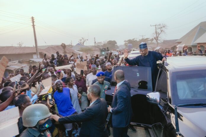 Gov. Uba Sani waving to citizens of Kuriga at his visit there March 7. Courtesy of Uba Sani on Twitter.