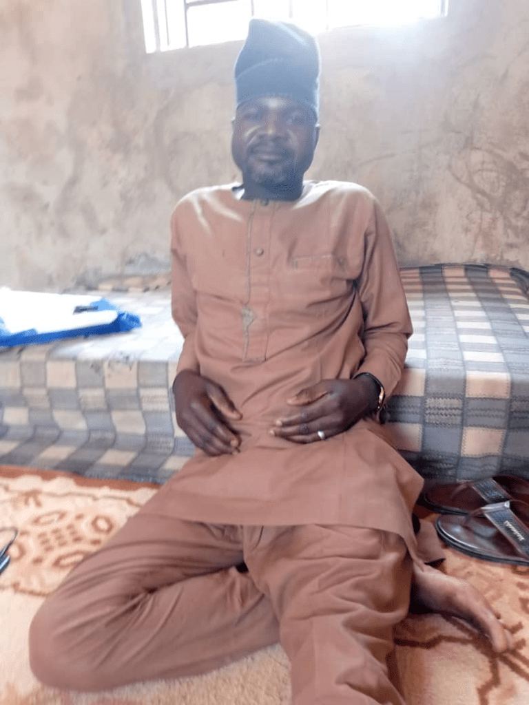 Tribal Chief of Karuga Karji, Ishaku Adamu, relaxing in his home after a foiled attack on his town March 13, 2024. Photo by Mike Odeh James.