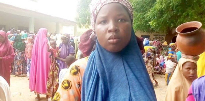 Zamfara girl at a camp awaiting grain distribution. Credit NEMA.