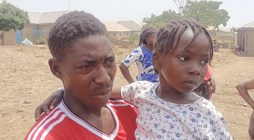 Escaped by the grace of God: Helen Iremiren, right, with her uncle in Gonin Gora, Nigeria on March 4, 2024.