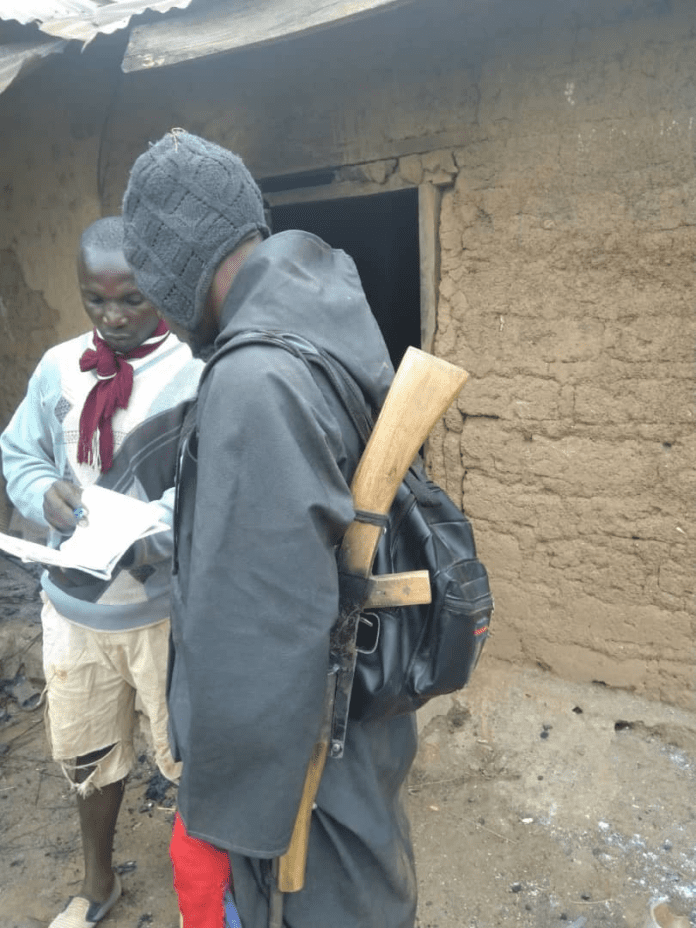 Citizen guards in Kaduna State, bordering Niger State, confer prior to an expected attack by Islamist mercenaries in 2020. photo by Lawrence Zongo