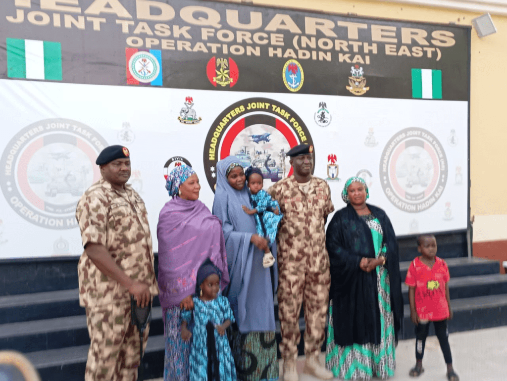 Gen. W. Shaibu, second from Right, beside Lydia Simon, having completed her families medical testing, presented at a press conference in Maiduguri. photo by Mike Odeh James.