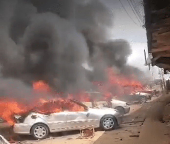 Screenshot of vehicles in flames. Photo credit: X/@AITOnline.