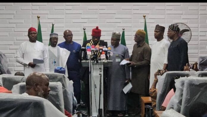 Lawmakers at a press briefing. Photo credit: /@IkengaImo