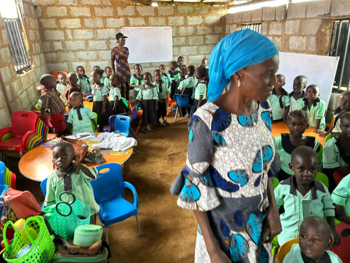 Raising the best and the brightest minds of New Kuchingoro Elementary School, headmaster Hanatu Ango, oversees lessons for 320 displaced kids whose parents are pushed off their land by Islamist terrorists. Credit Mike Arnold