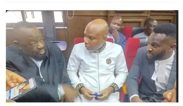 Nnamdi Kanu (middle) with his lawyers in court. Photo credit: Facebook/Igbo TV.