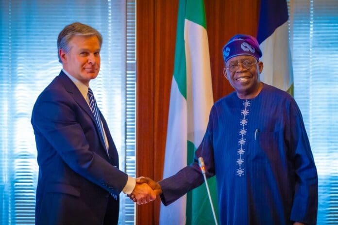 President Tinubu and FBI Director Christopher Asher Wray. Photo credit: X/@FrederickNwabufo.