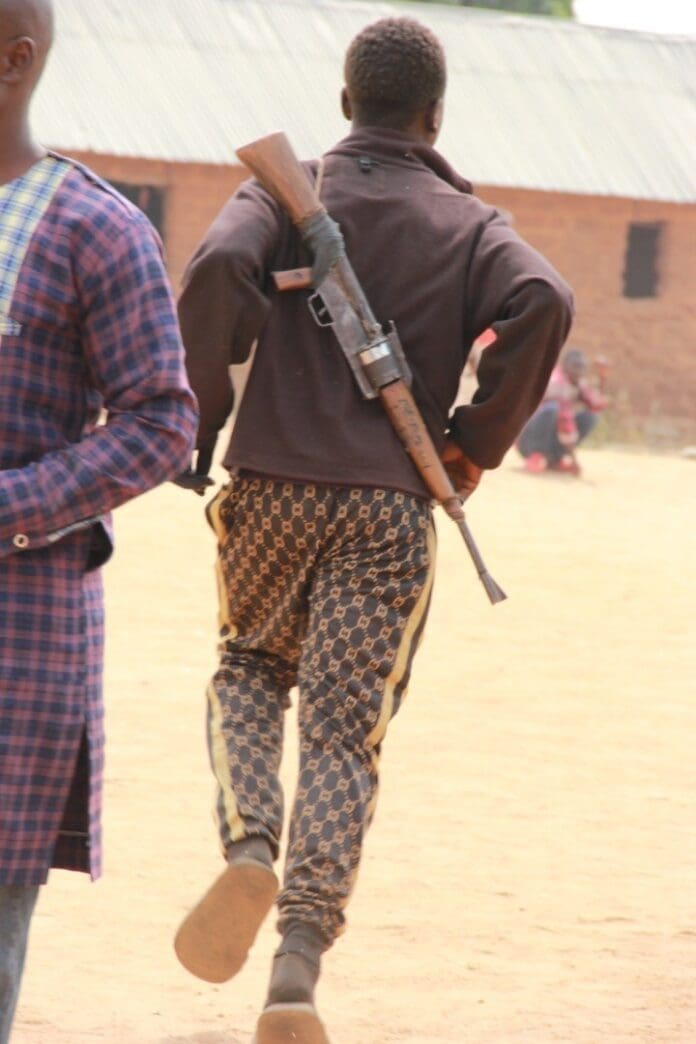 Citizen Guard running to defend his village in Southern Kaduna in 2021. credit: Masara Kim.