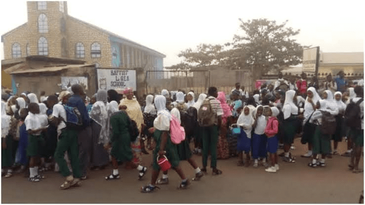 Students and parents march in front of a Baptist school in Kwara to object to the imposition of the hijab at their school. Photo by: Mike Odeh James