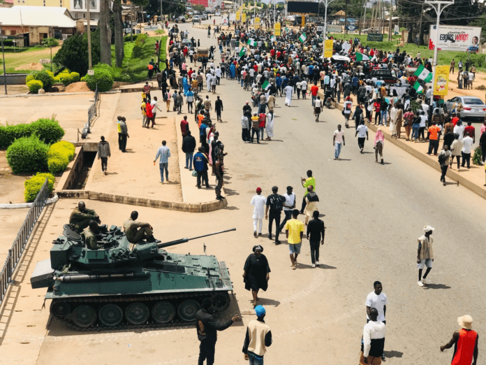 Military truck parked at a protest venue in Jos on August 2. Credit: Masara Kim.