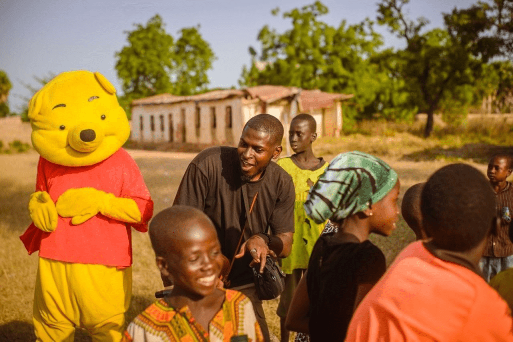 Peter Shantong, center above, has been involved in humanitarian work, offering free medical care to displaced children but never knew he would some day face the same threat as the displaced children. Courtesy Paul Shantong on Facebook