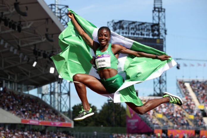 Tobi Amusan with the Nigerian flag. Photo credit: X/@Evaglobal01.
