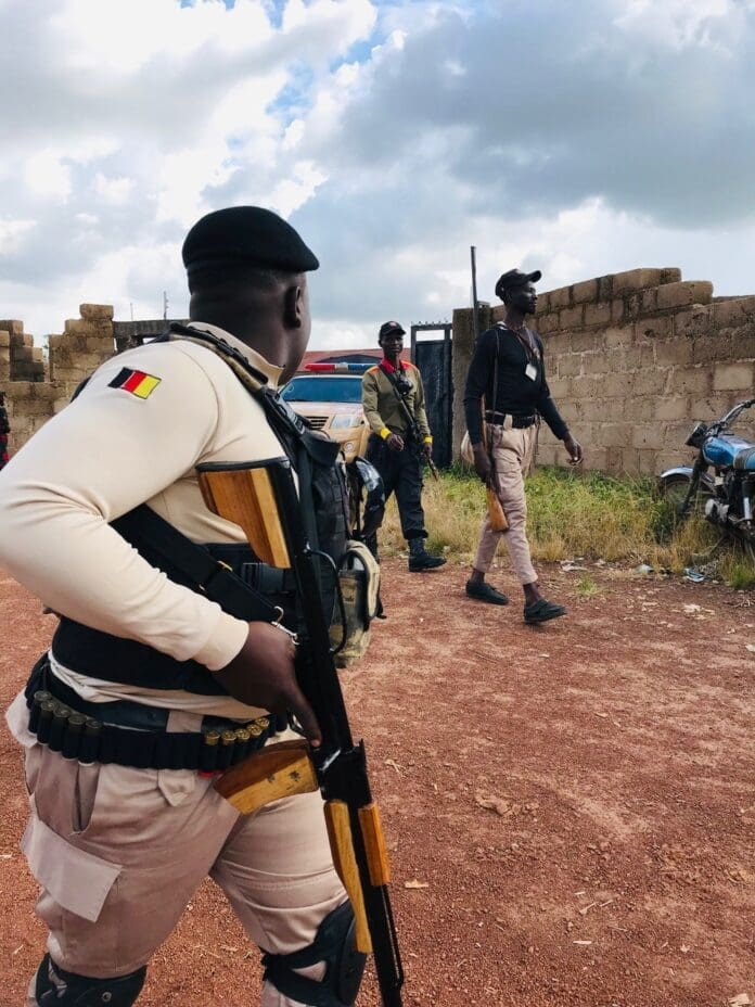 A uniformed civilian guard volunteer bravely leads his team protecting a civilian gathering in Bokkos on September 21, 2024. This is the same location as the attack on July 24, 2025. Credit: Masara Kim.