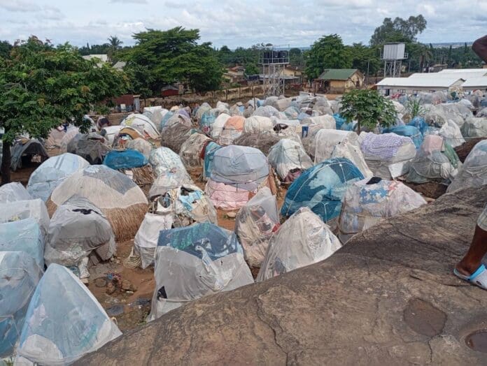 Makurdi IDP camp shows families sheltering under mosquito net shelters. Credit: Mike Odeh James.