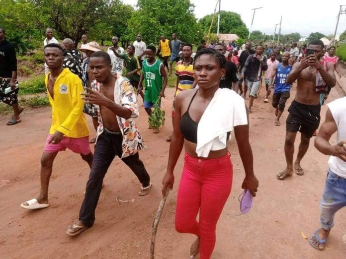 Citizens on the Warpath. Residents of Ayati Village in Ukum County, Southeast of Makurdi, march to protest military negligence in the massacre of 11 people in Ayati without military intervention on July 2, 2024. Prior to that attack three people were murdered by Fulani Ethnic Militia in Gwer West. Military negligence or complicity with terrorist attacks have been cited by citizen advocates in several local governance areas of Benue. credit: Mike Odeh James.
