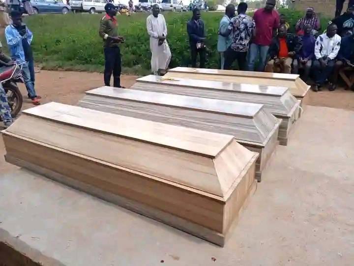 Coffins of four victims of a mining camp in the Kuba village of Bokkos county of Plateau State on October 10 are lined up for burial on October 11. Credit Masara Kim
