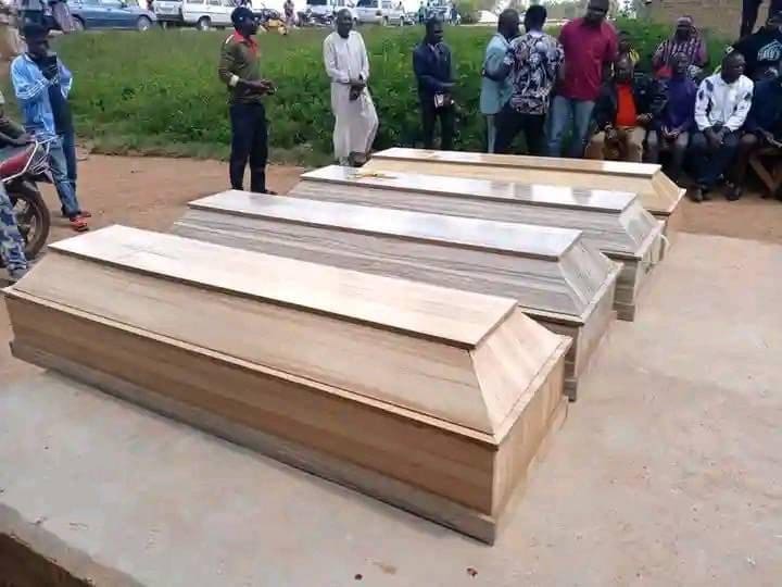 Coffins of four victims of a mining camp in the Kuba village of Bokkos county of Plateau State on October 10 are lined up for burial on October 11. Credit Masara Kim