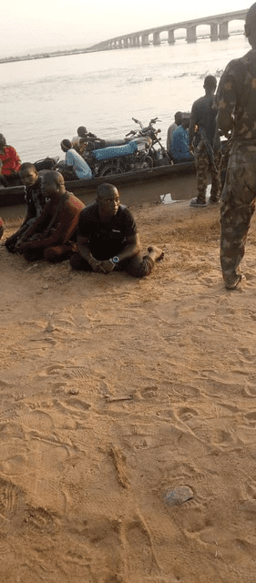 Four suspected terrorists waiting for orders from Nigerian Navy officers. Credit: Michael Odeh James.