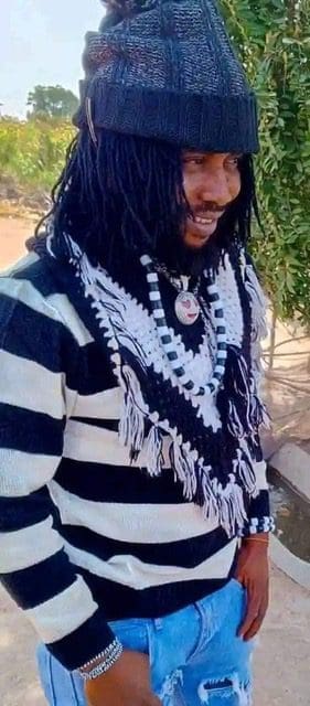 Terhemen Mzaga a.k.a Full Fire, poseS with a car at an unknown location, September, 2024 (Credit: Facebook).