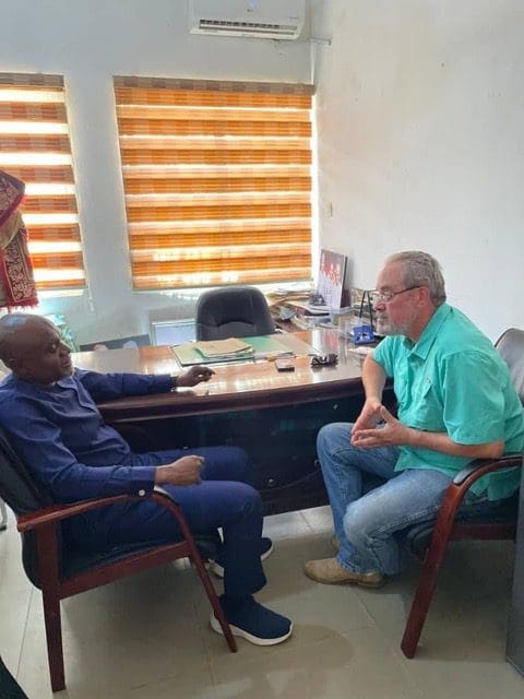 Garki hospital administrator hears plea from philanthropist Mike Arnold, right, on Oct. 24. Credit: Mike Arnold.