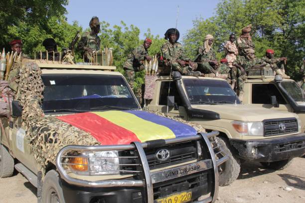 Soldiers of Chad’s Army stand in their armored Toyota gun trucks, equipped with heavy machine guns and rocket-propelled grenades. Credit: Chad Army.