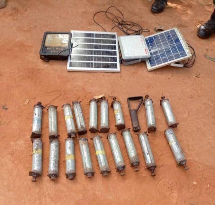 Explosives and solar panels recovered from raided criminal den. Photo credit: The Punch.