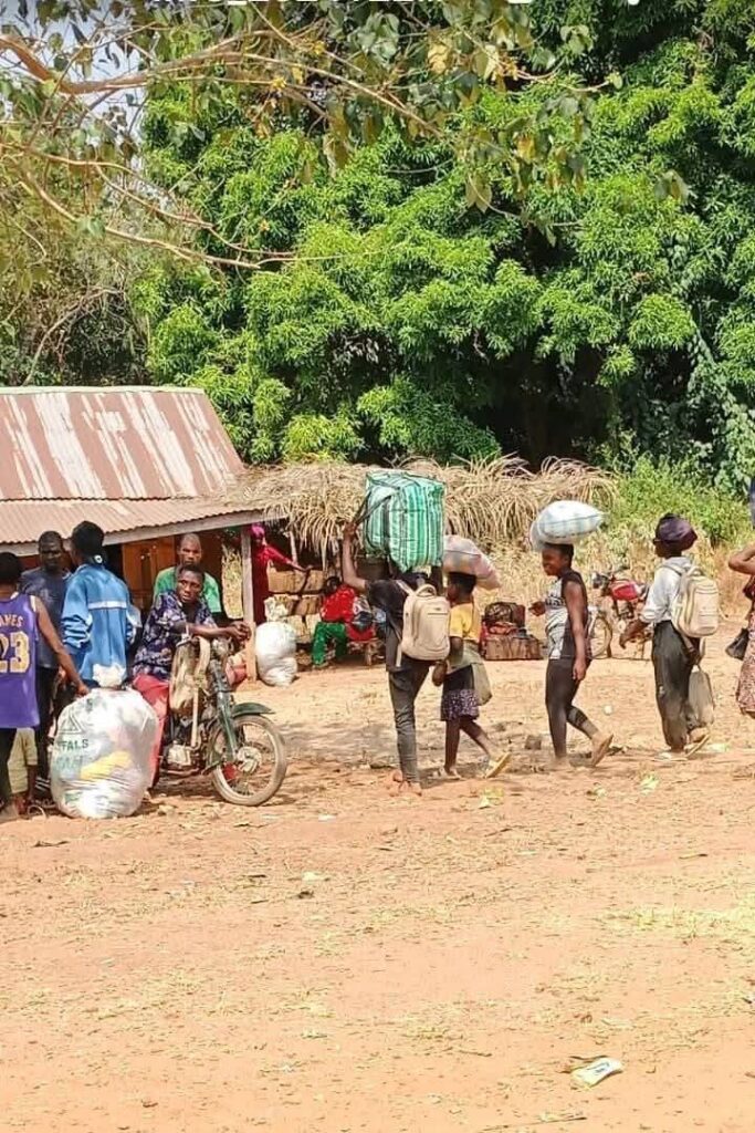 Residents of Iyaav town leaving for a safer venue. Credit: Olikita Ekani.