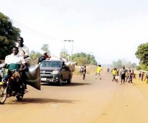 Residents of terror-stricken villages of Guma County fleeing to more secure areas. Credit: Ekani Olikita.