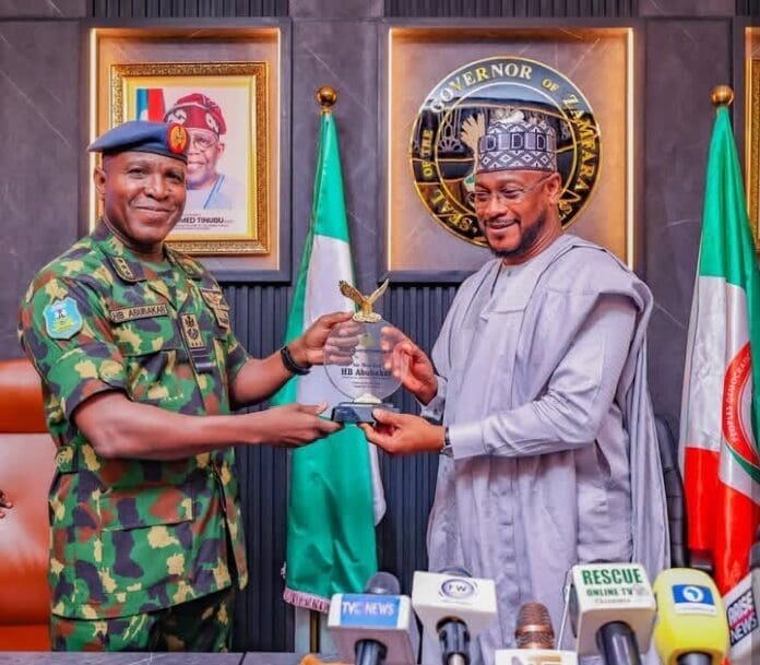 Air Marshal Hasan Abubakar, Chief of the Air Staff (LEFT- in military uniform) in a handshake with Governor Lawal Dauda, the Executive Governor of Zamfara state. Courtesy: Zamfara state government media