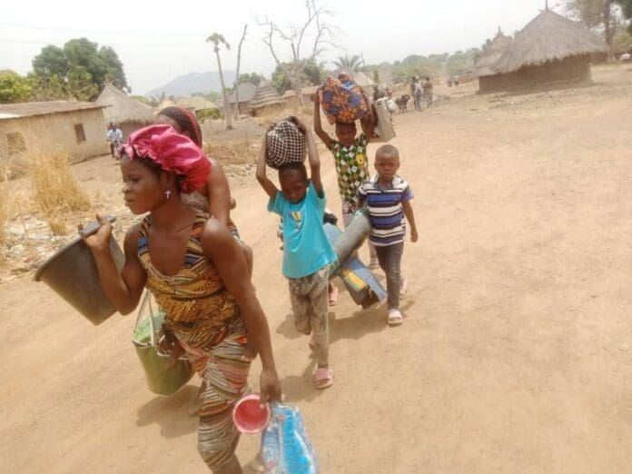 Christian residents of Kusheka hastily leaving their village for fear of kidnappers. Credit:  Mike Odeh James.