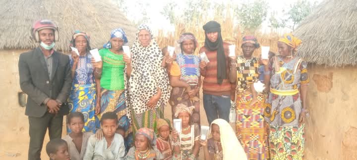 Evangelist Buba Adamu (on black head cover) in a group photograph with Christian concerts in the SAHEL, displaying communication gadget shared by Evang. Buba.