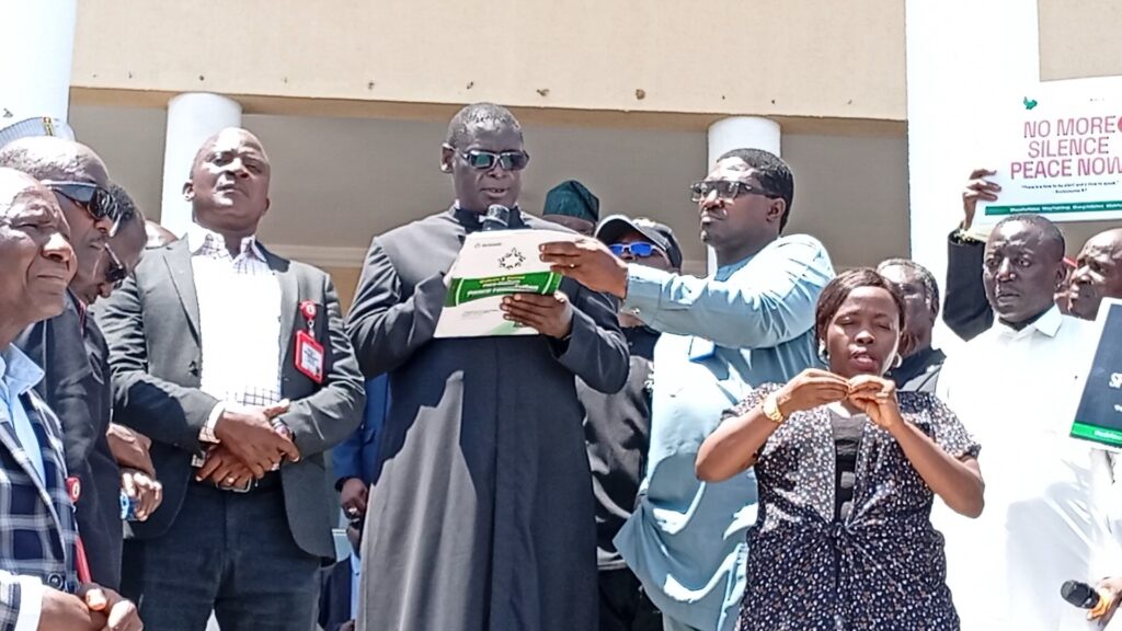Rev. Dr. Amos Mohzo, the President of the Church Denominational Leaders' Forum in Plateau State delivers the concerns of Christians during a peaceful demonstration in Jos on April 21