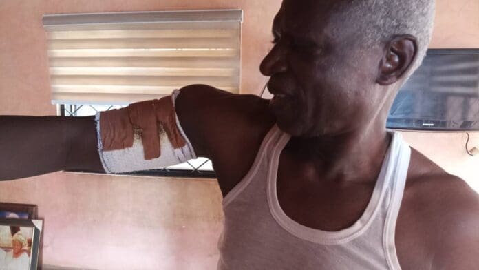 Pastor Knudowan being treated after attack. Photo by Mike Odeh James.